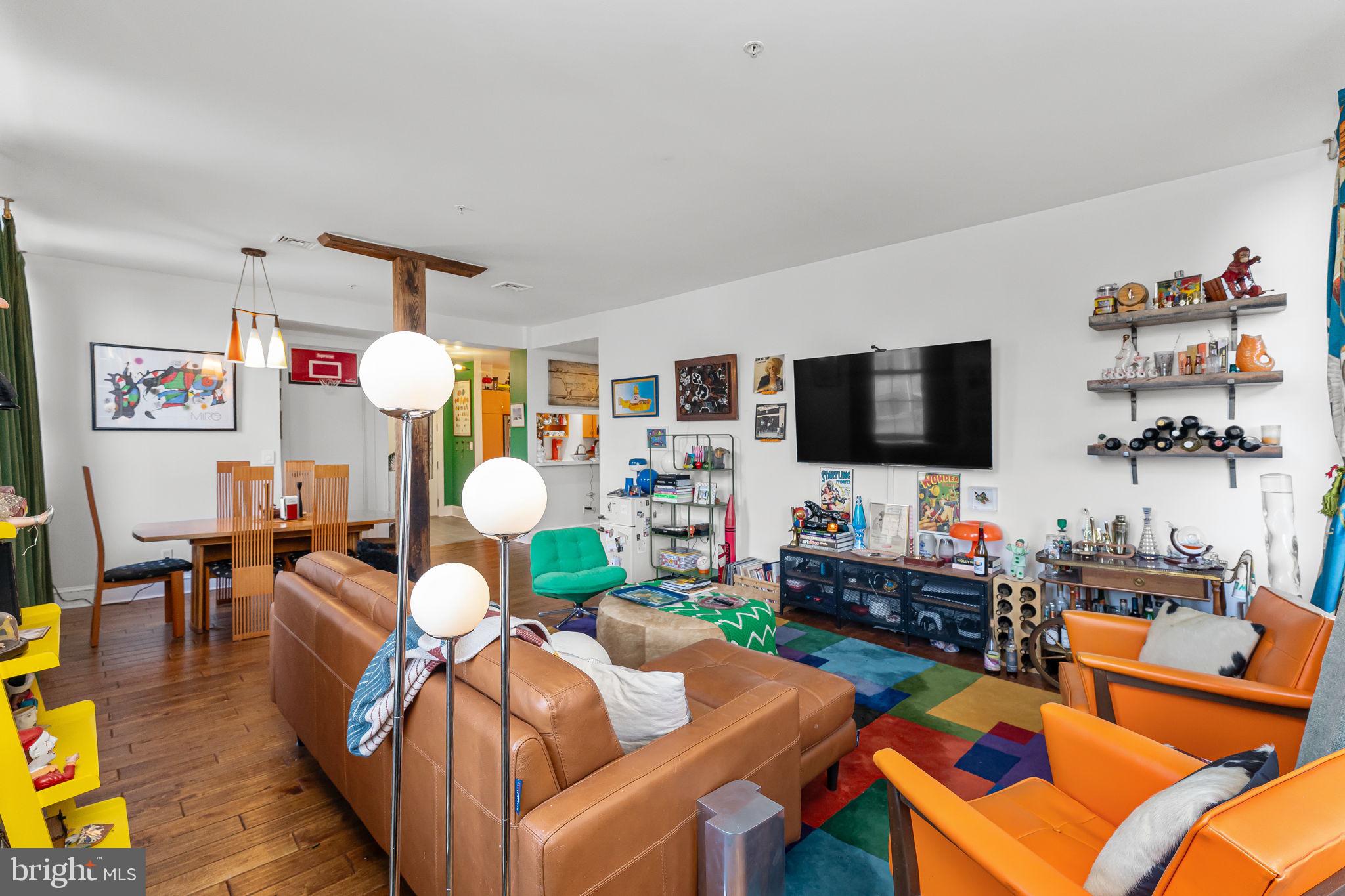 214 New Street, Unit G Philadelphia, PA 19106 - Photo 11 of 17 a living room with furniture and a flat screen tv