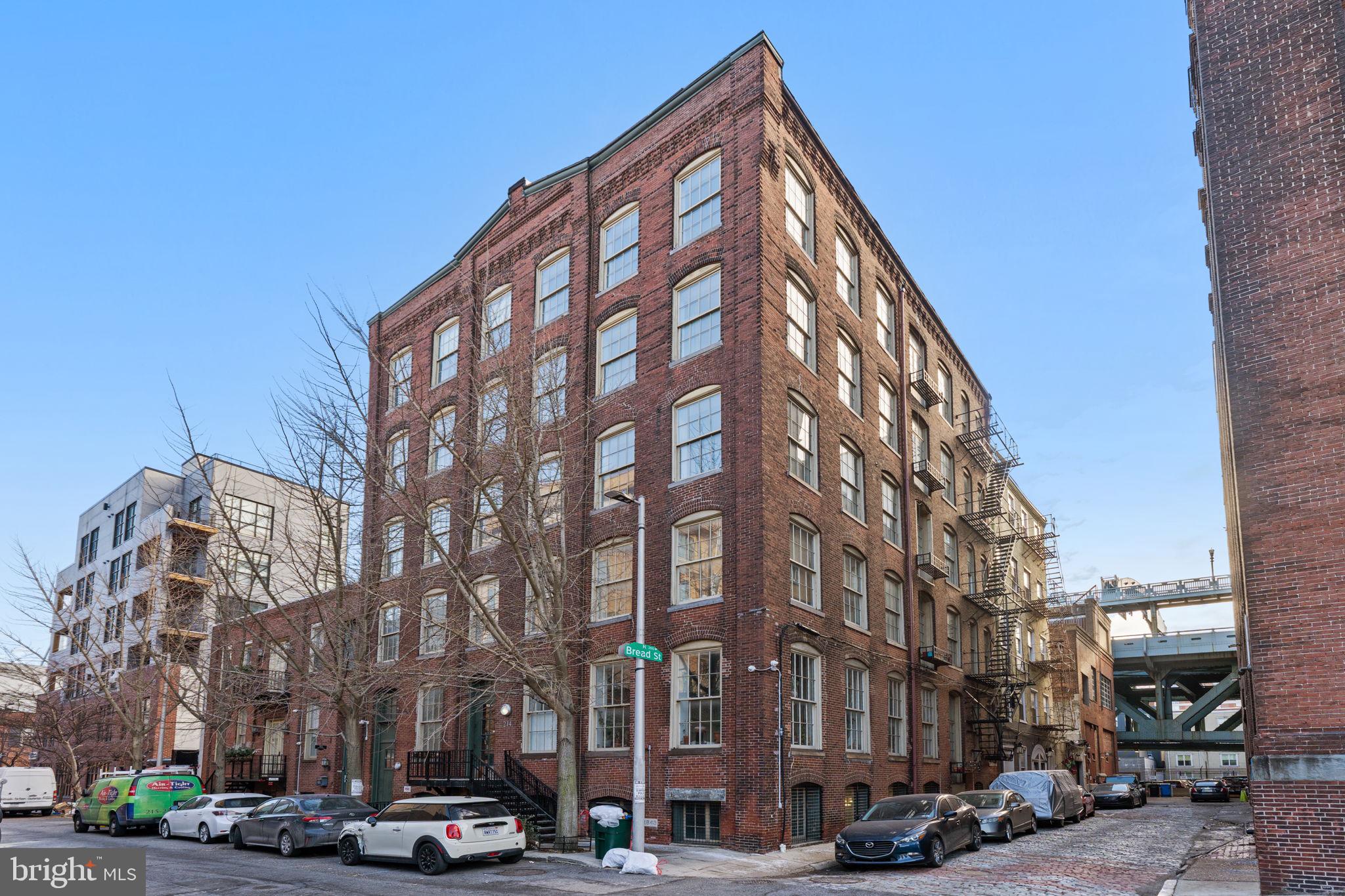 214 New Street, Unit G Philadelphia, PA 19106 - Photo 2 of 17 a view of a tall building next to a road