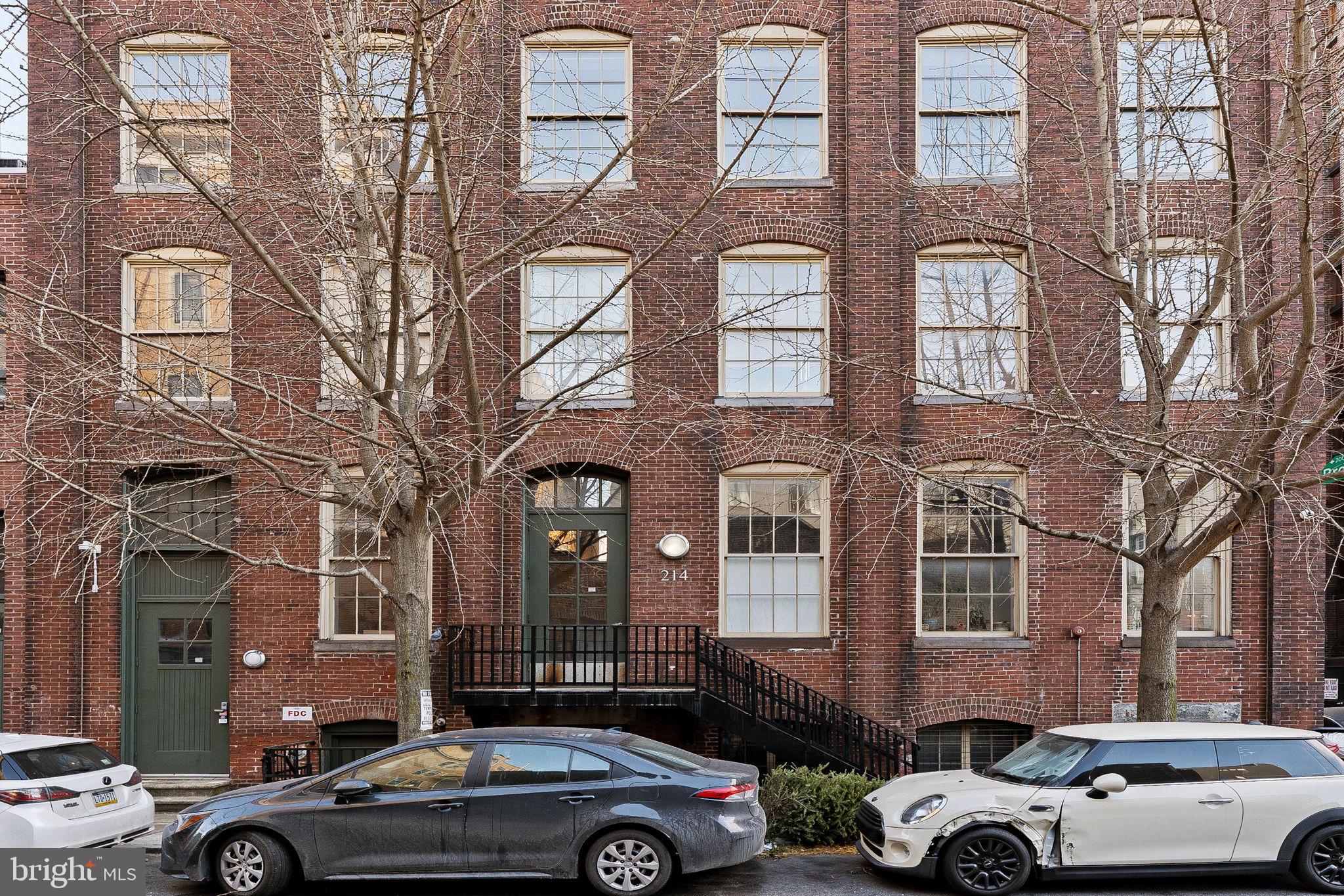 214 New Street, Unit G Philadelphia, PA 19106 - Photo 3 of 17 a front view of a building with car parked