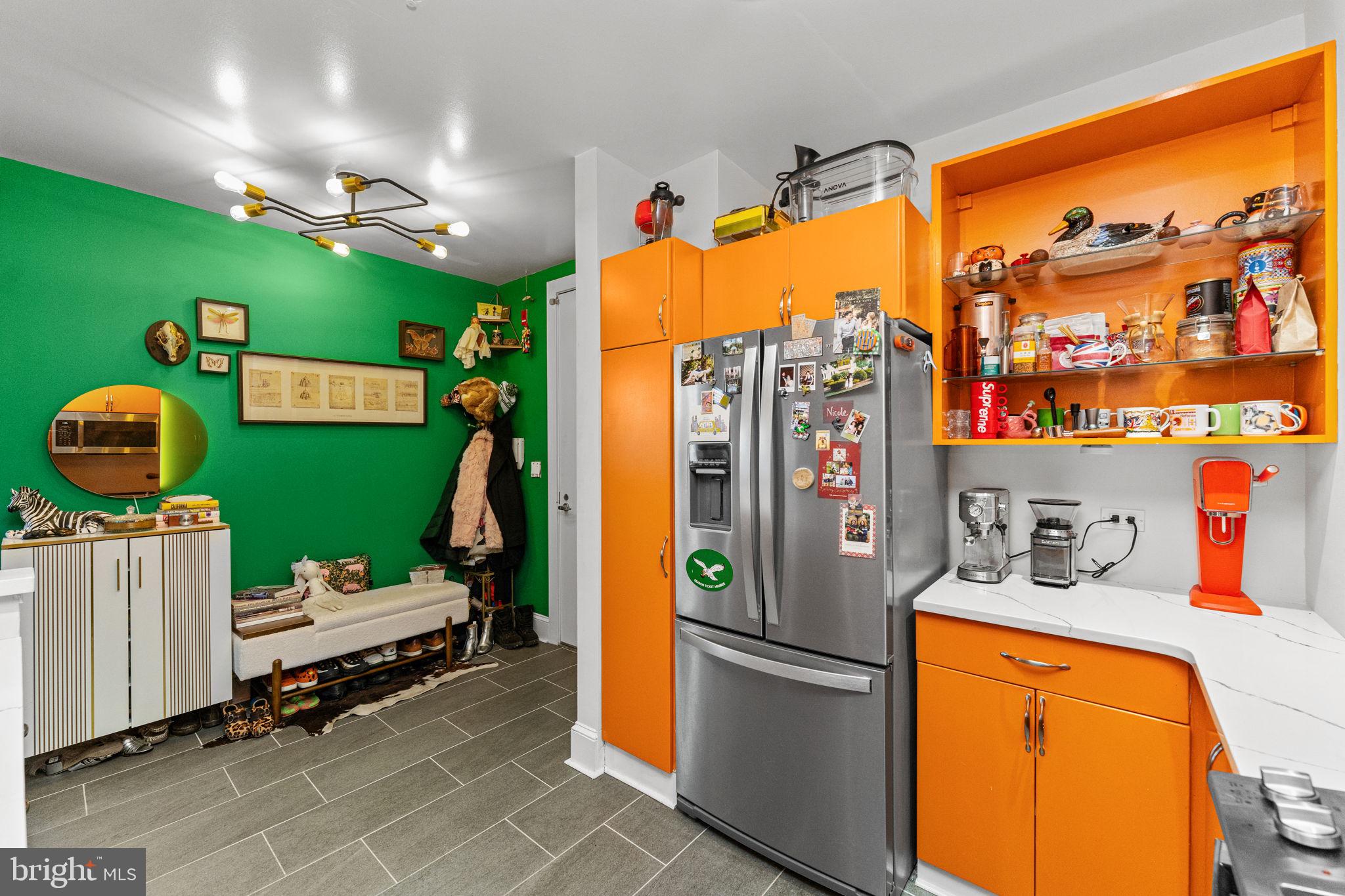 214 New Street, Unit G Philadelphia, PA 19106 - Photo 7 of 17 a kitchen with refrigerator and washer