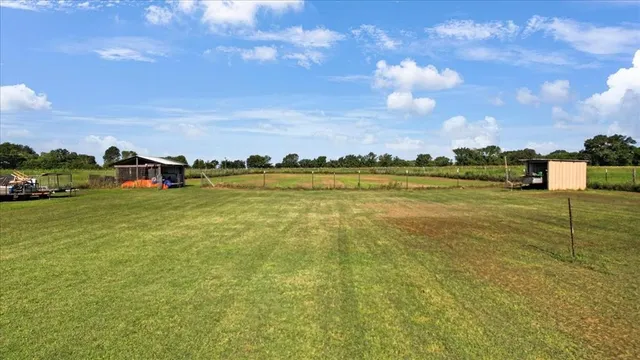 a view of a lake with houses in the background