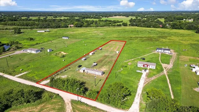 a view of a city with lush green forest