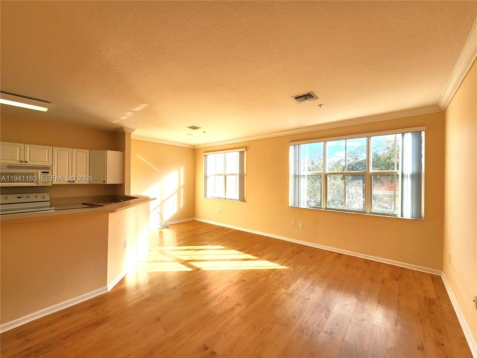4602 Southwest 160th Avenue, Unit 524 Miramar, FL 33027 - Photo 11 of 33 a view of empty room with wooden floor and fan