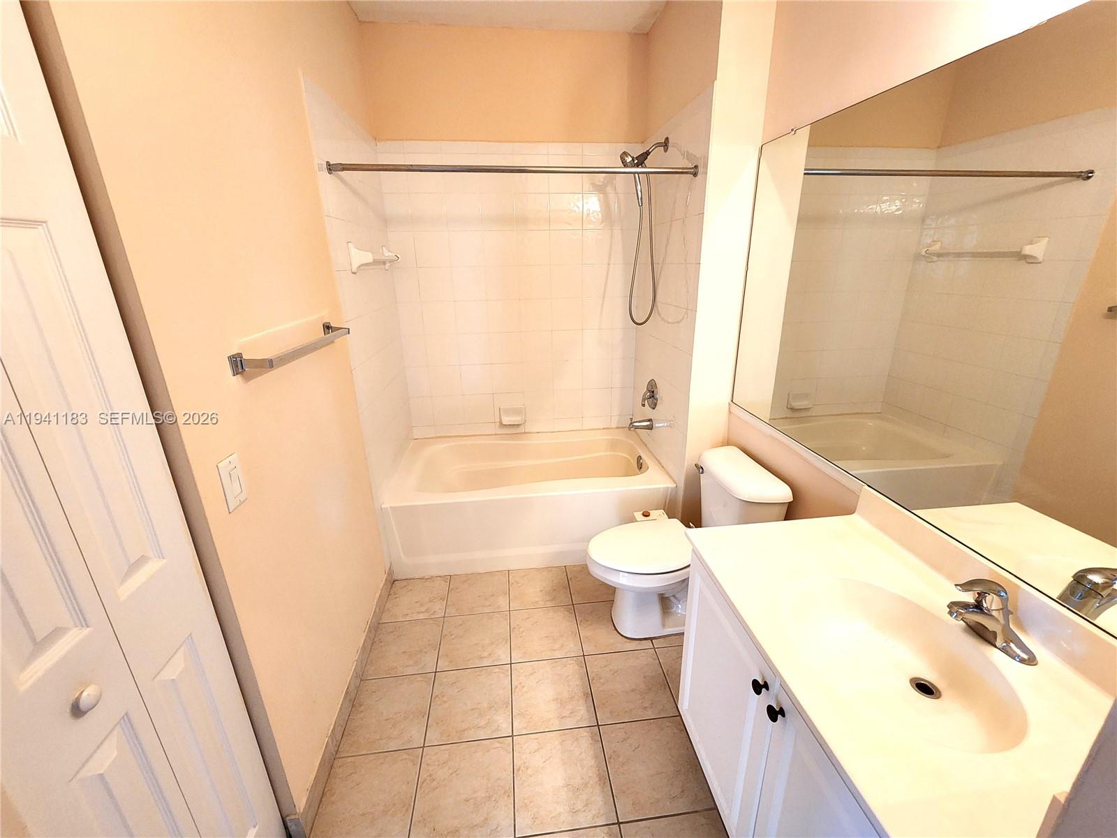 4602 Southwest 160th Avenue, Unit 524 Miramar, FL 33027 - Photo 23 of 33 a bathroom with a sink a toilet and shower
