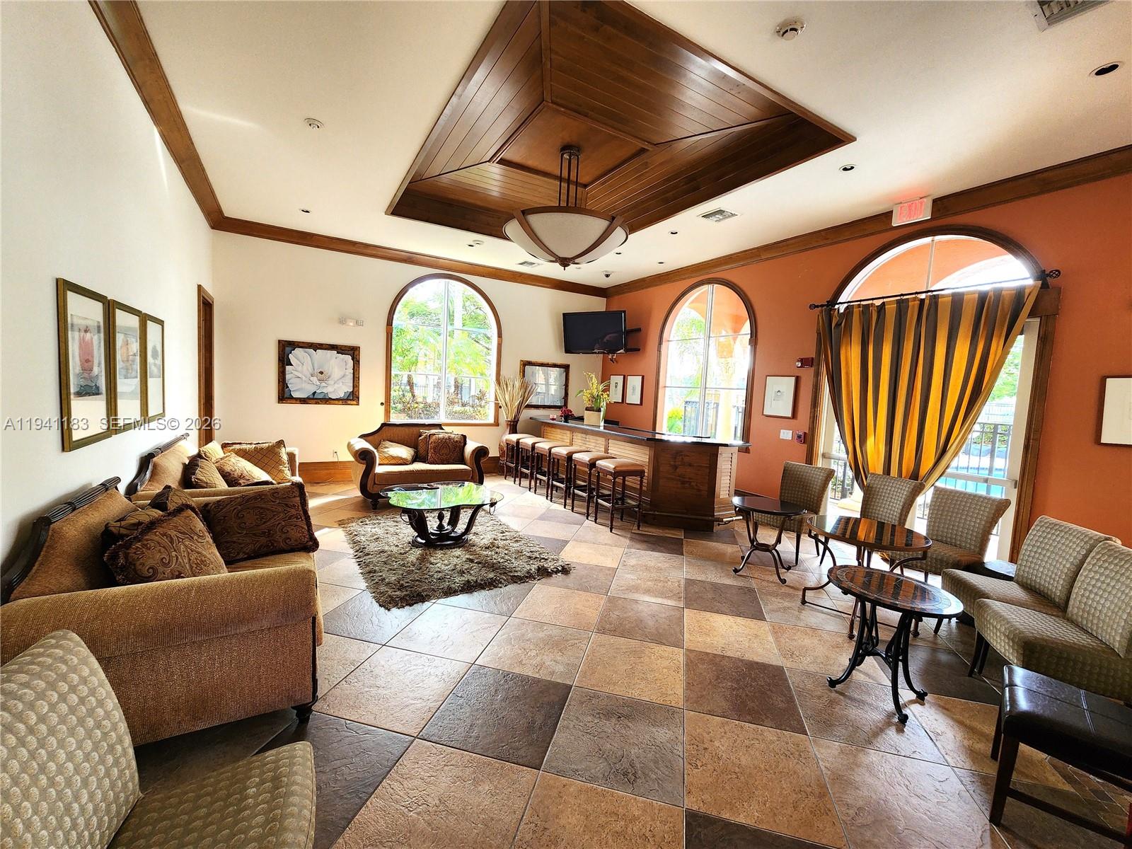 4602 Southwest 160th Avenue, Unit 524 Miramar, FL 33027 - Photo 24 of 33 a living room with furniture fireplace and a large window