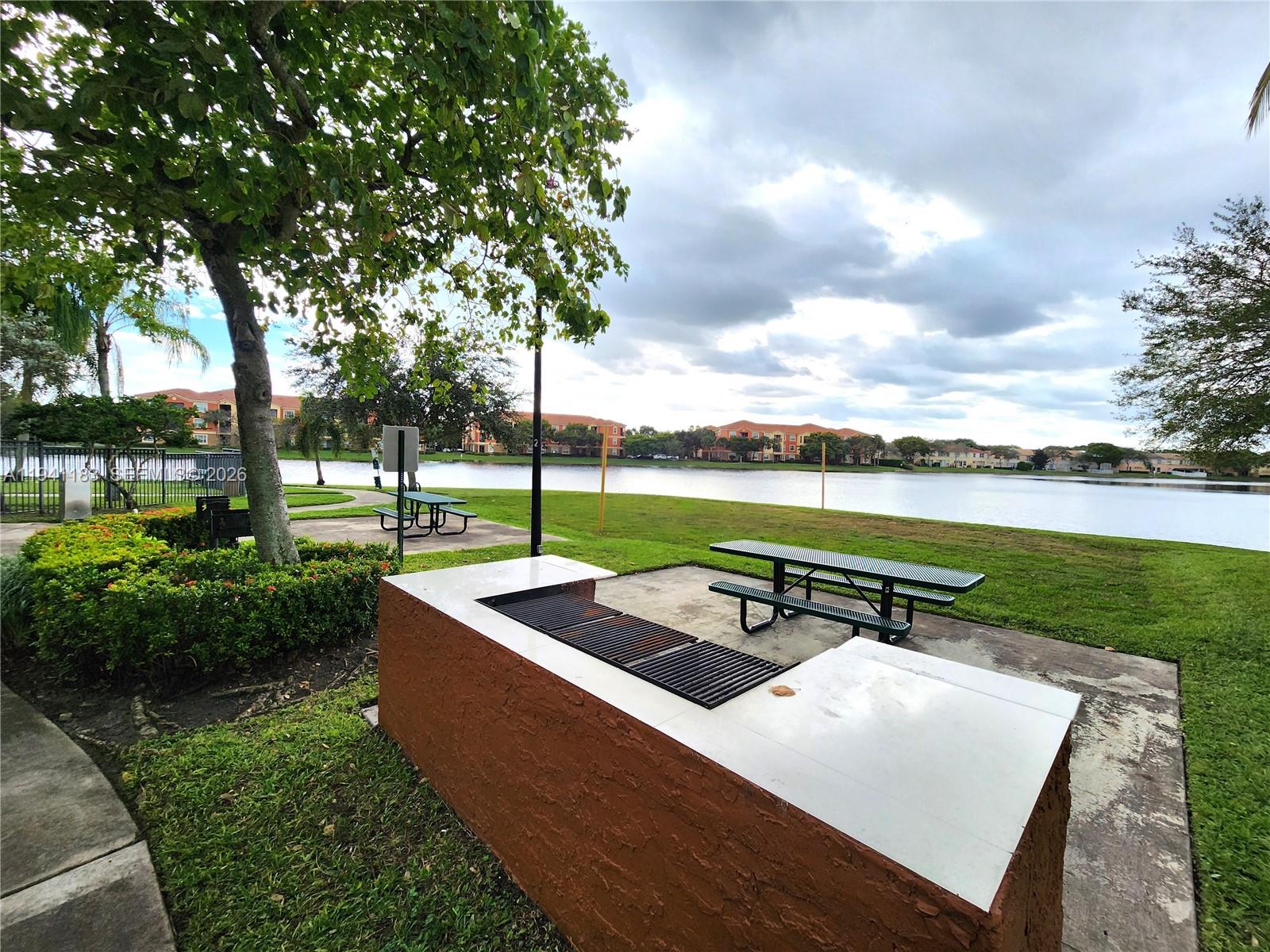 4602 Southwest 160th Avenue, Unit 524 Miramar, FL 33027 - Photo 30 of 33 a view of a garden with sitting area