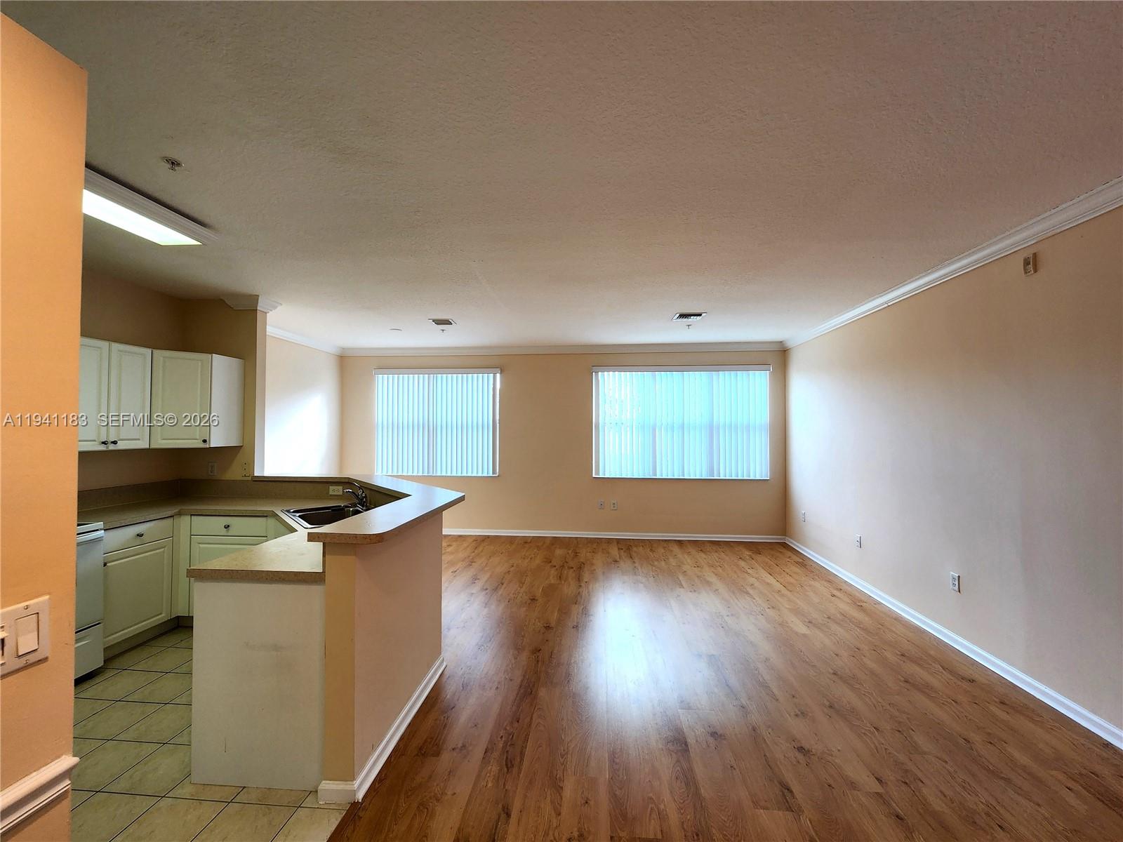 4602 Southwest 160th Avenue, Unit 524 Miramar, FL 33027 - Photo 3 of 33 a kitchen with stainless steel appliances granite countertop a stove a sink and a refrigerator
