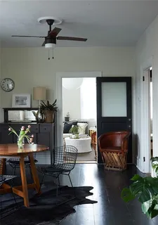 a bedroom with a bed and a night stand