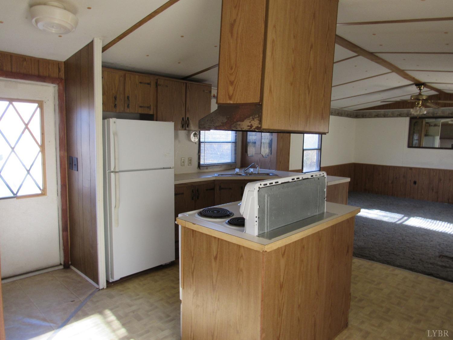 533 Maple Run Road Amherst, VA 24521 - Photo 7 of 16 a kitchen with refrigerator a microwave a sink and a stove