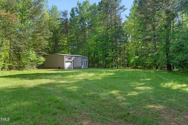 a big yard with large trees