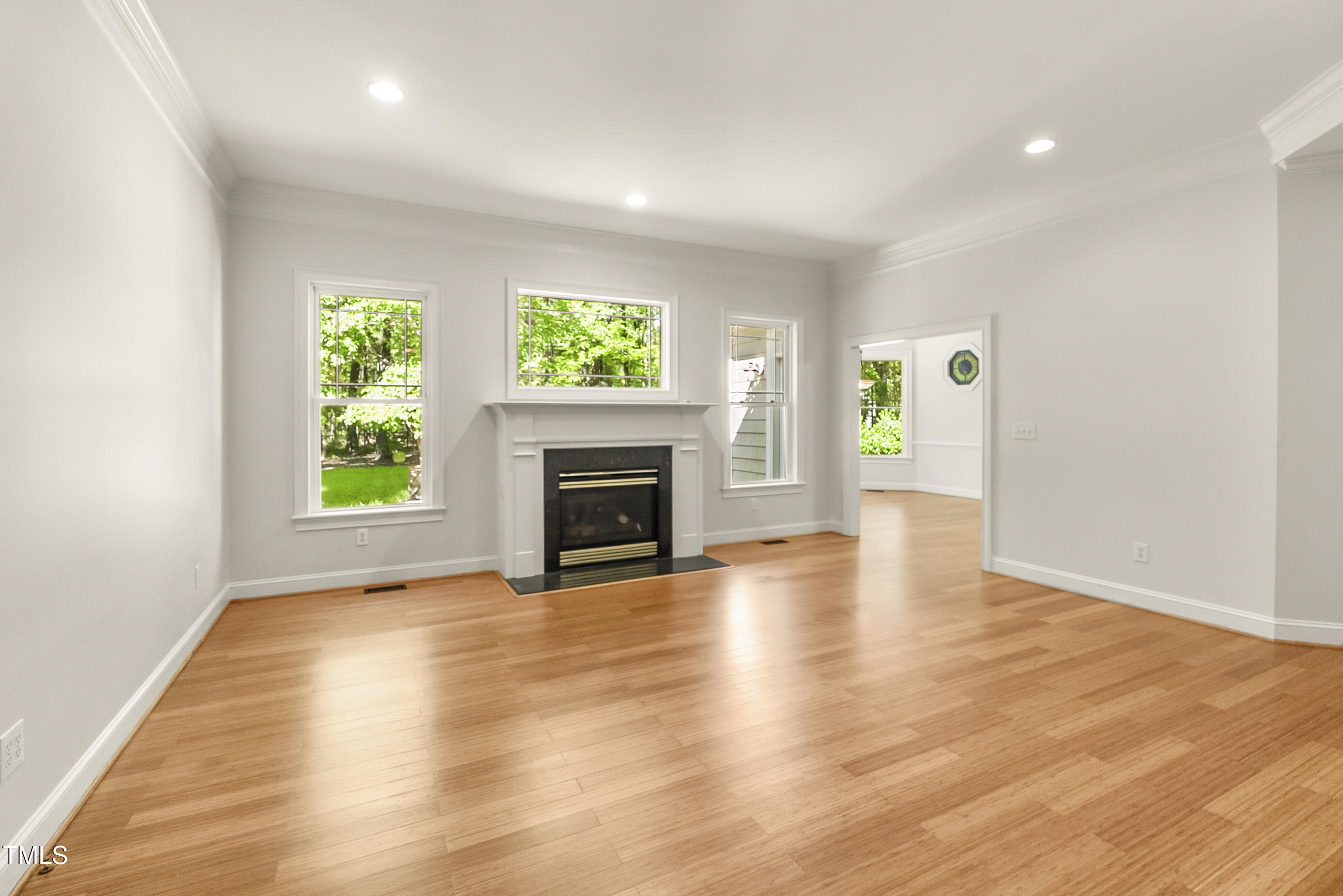 2819 Ellis Chapel Road Bahama, NC 27503 - Photo 4 of 22 a view of empty room with wooden floor and fireplace