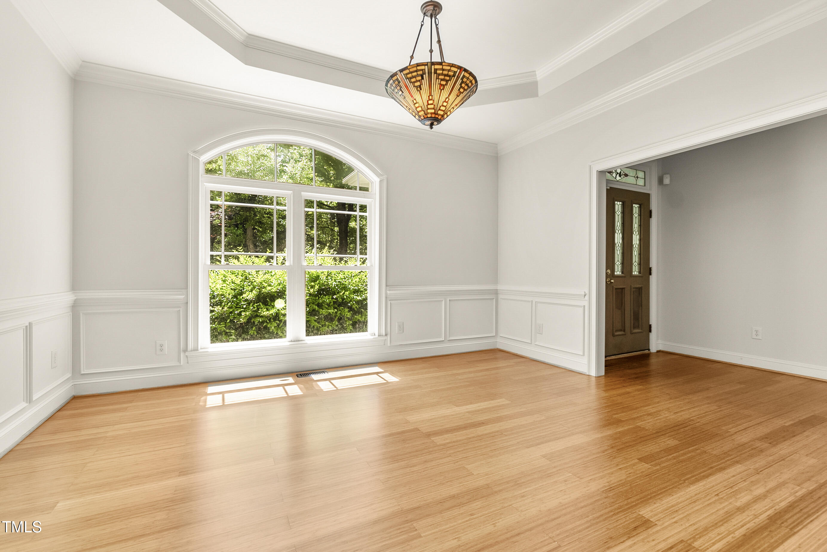 2819 Ellis Chapel Road Bahama, NC 27503 - Photo 7 of 22 a view of an empty room with wooden floor and a window