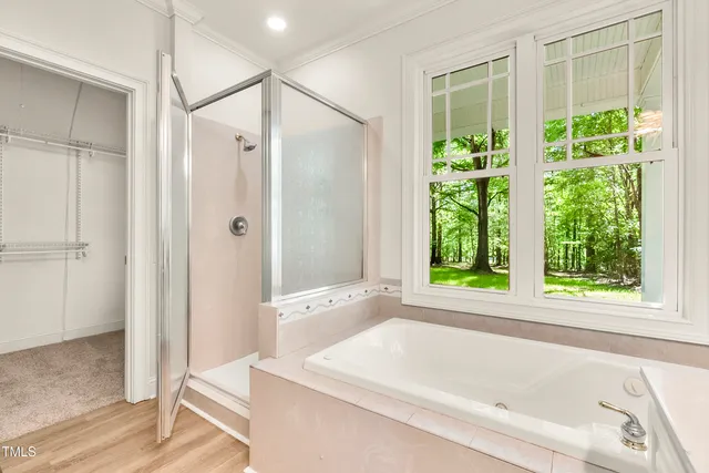 a bathroom with a bathtub and shower