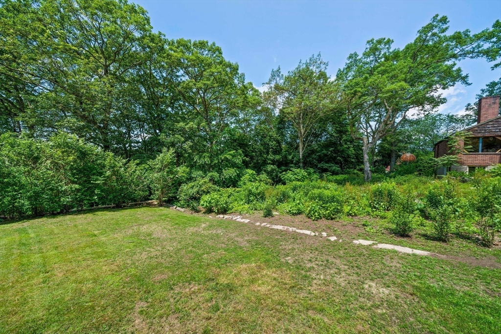 335 Langley Road Newton, MA 02459 - Photo 11 of 15 a view of an outdoor space and a yard