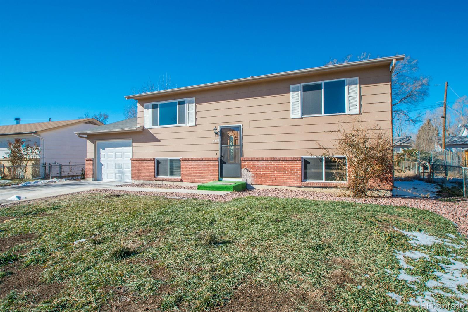 1708 Keswick Road Colorado Springs, CO 80906 - Photo 1 of 1 a house view with a garden space