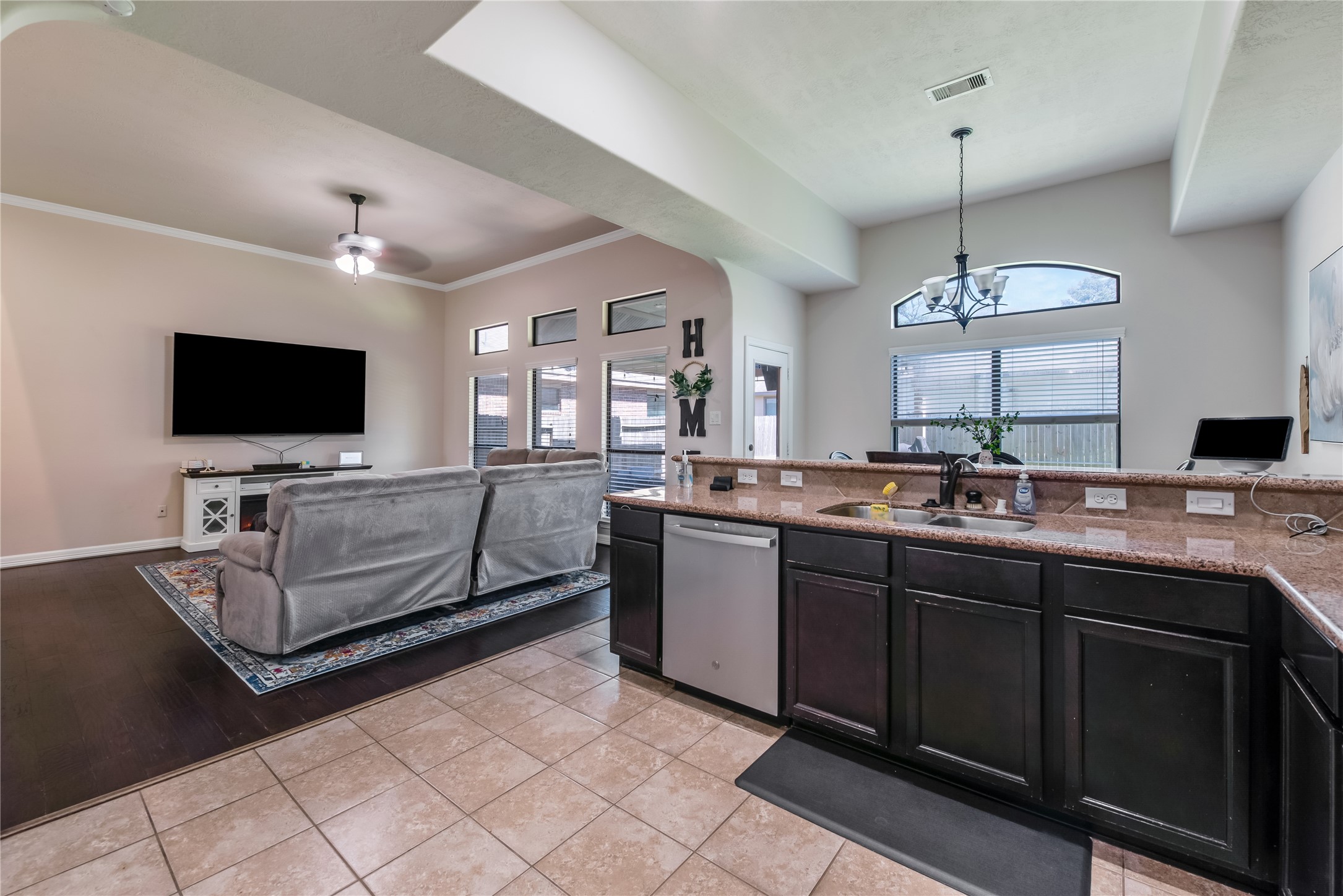 25118 Andris Lane Spring, TX 77386 - Photo 12 of 42 a living room with granite countertop furniture and a flat screen tv