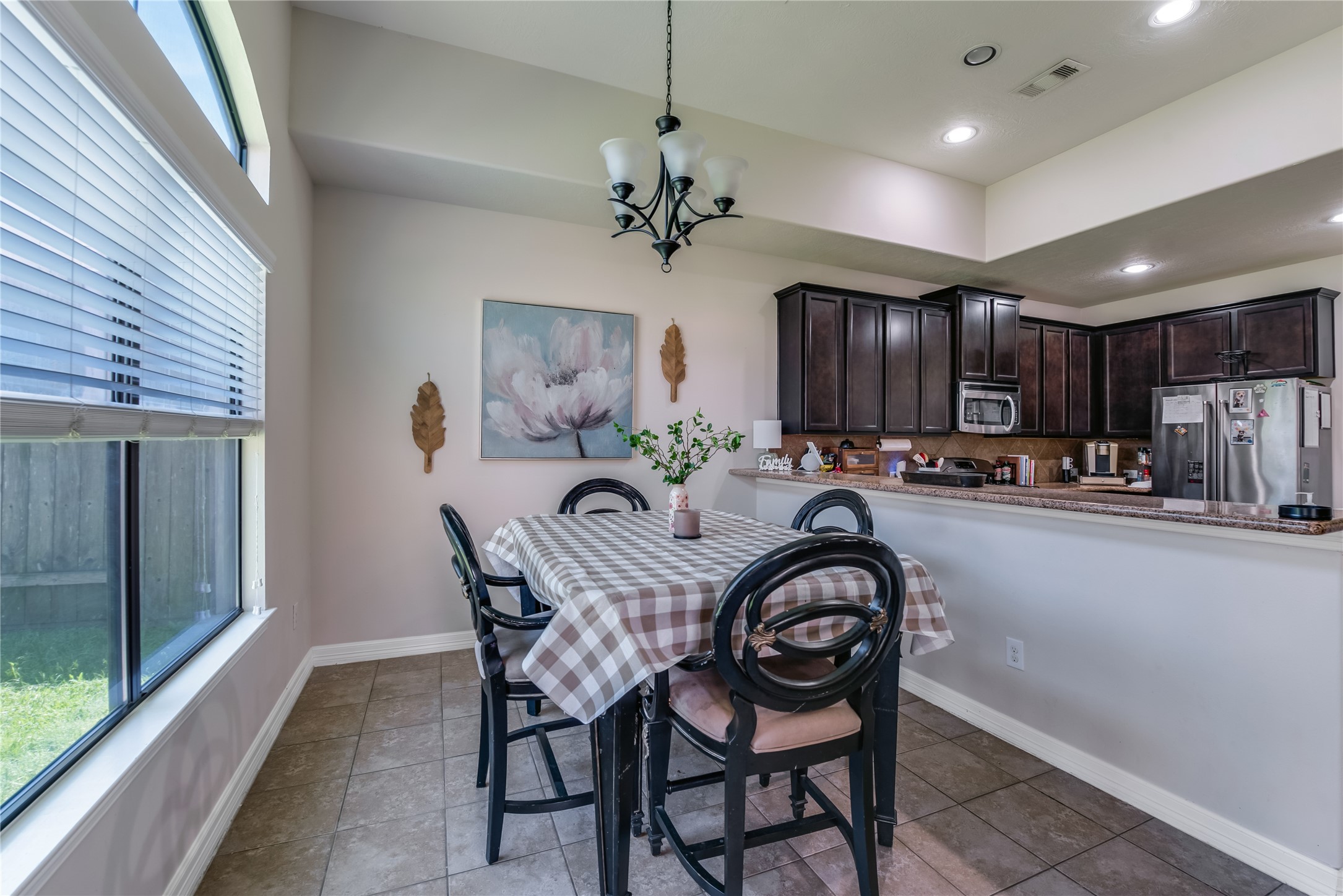 25118 Andris Lane Spring, TX 77386 - Photo 16 of 42 a view of a dining room with furniture a chandelier and window