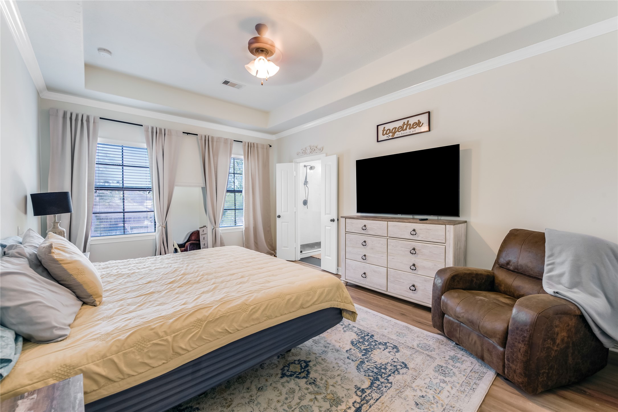 25118 Andris Lane Spring, TX 77386 - Photo 20 of 42 a bedroom with a bed and a flat screen tv