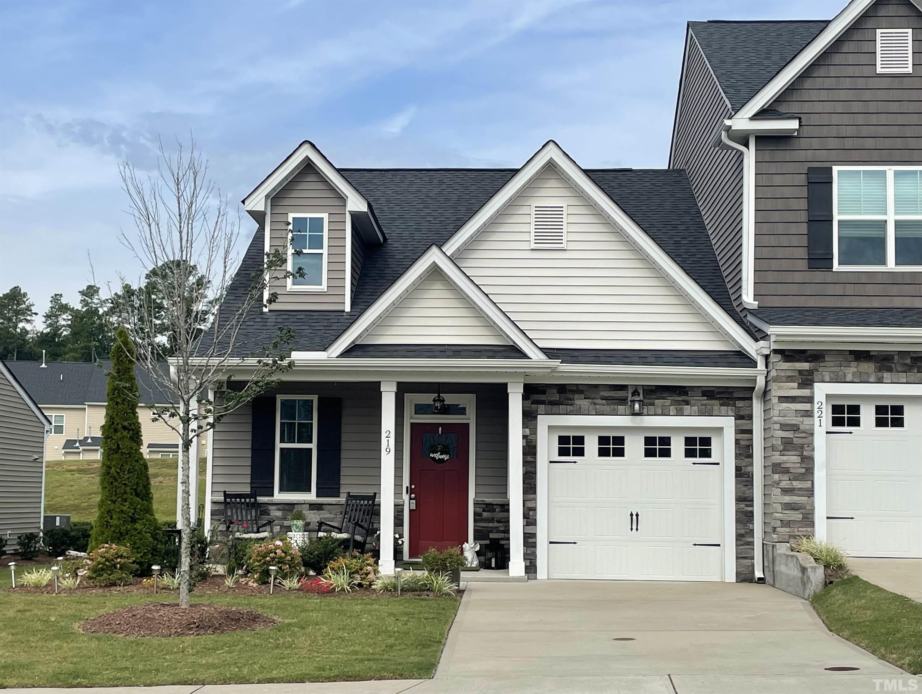 front view of a house with a yard