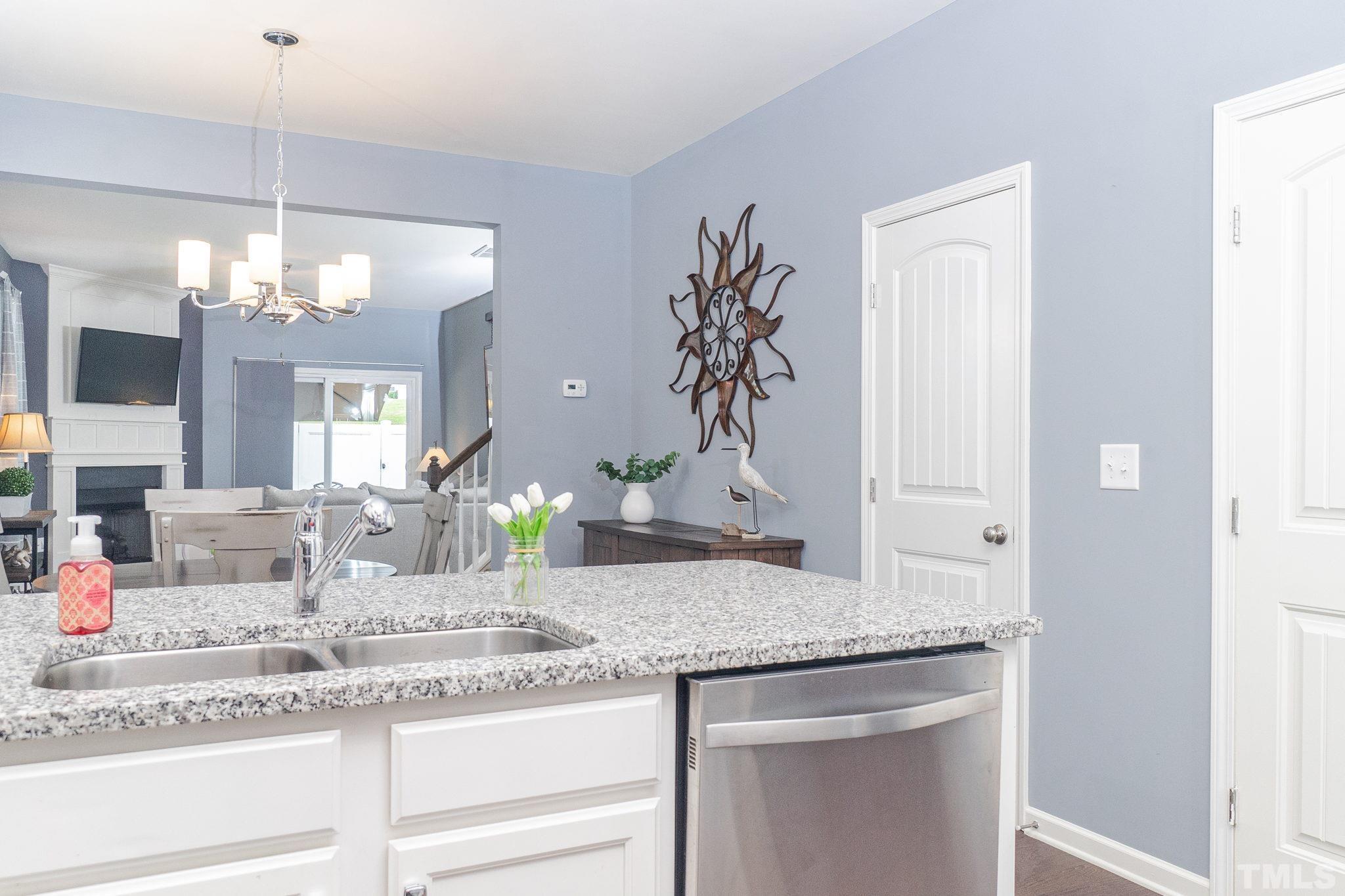 219 Torpoint Road Durham, NC 27703 - Photo 11 of 43 a bathroom with a granite countertop sink and a mirror
