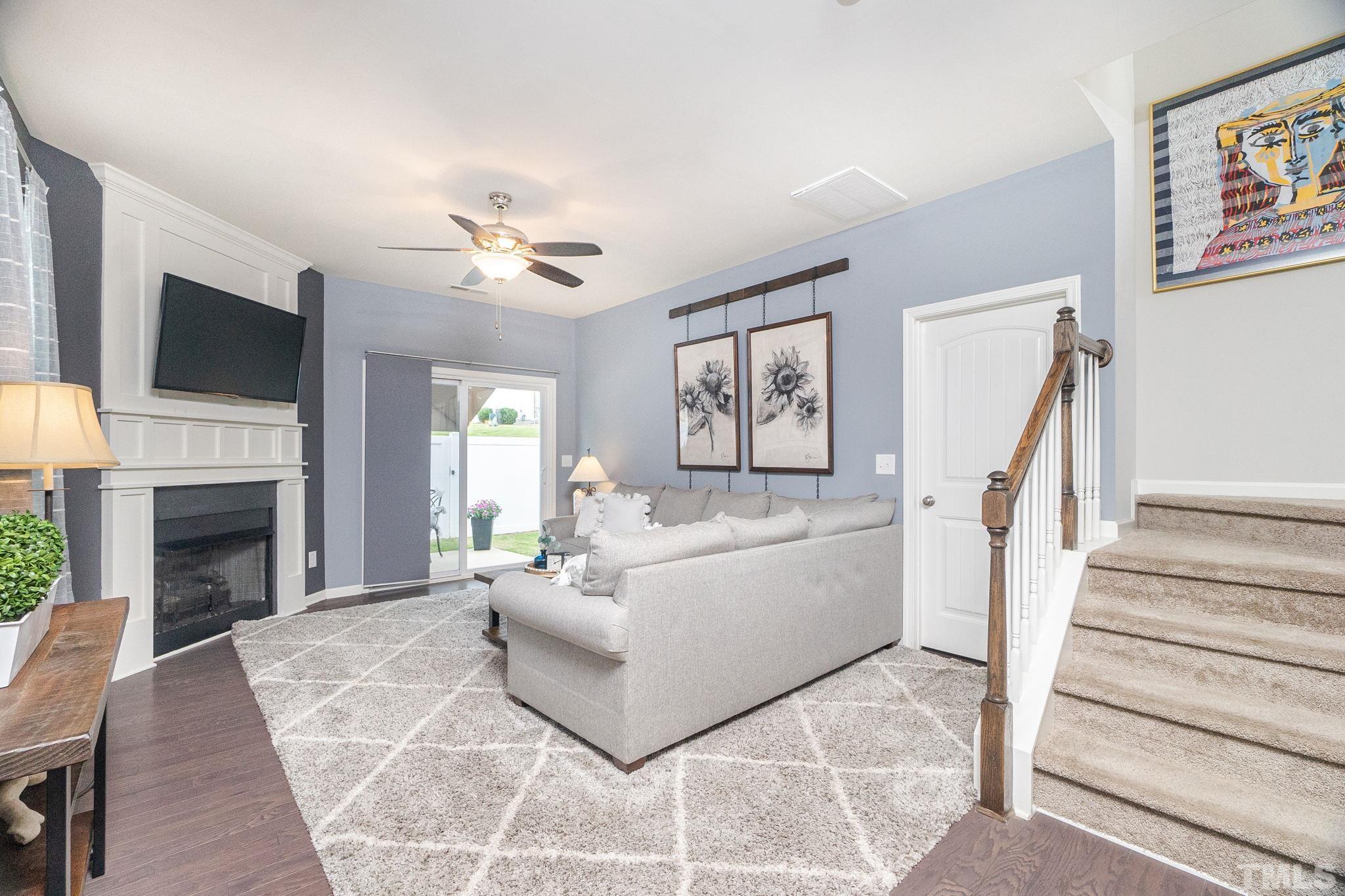 219 Torpoint Road Durham, NC 27703 - Photo 15 of 43 a living room with furniture fireplace and a flat screen tv