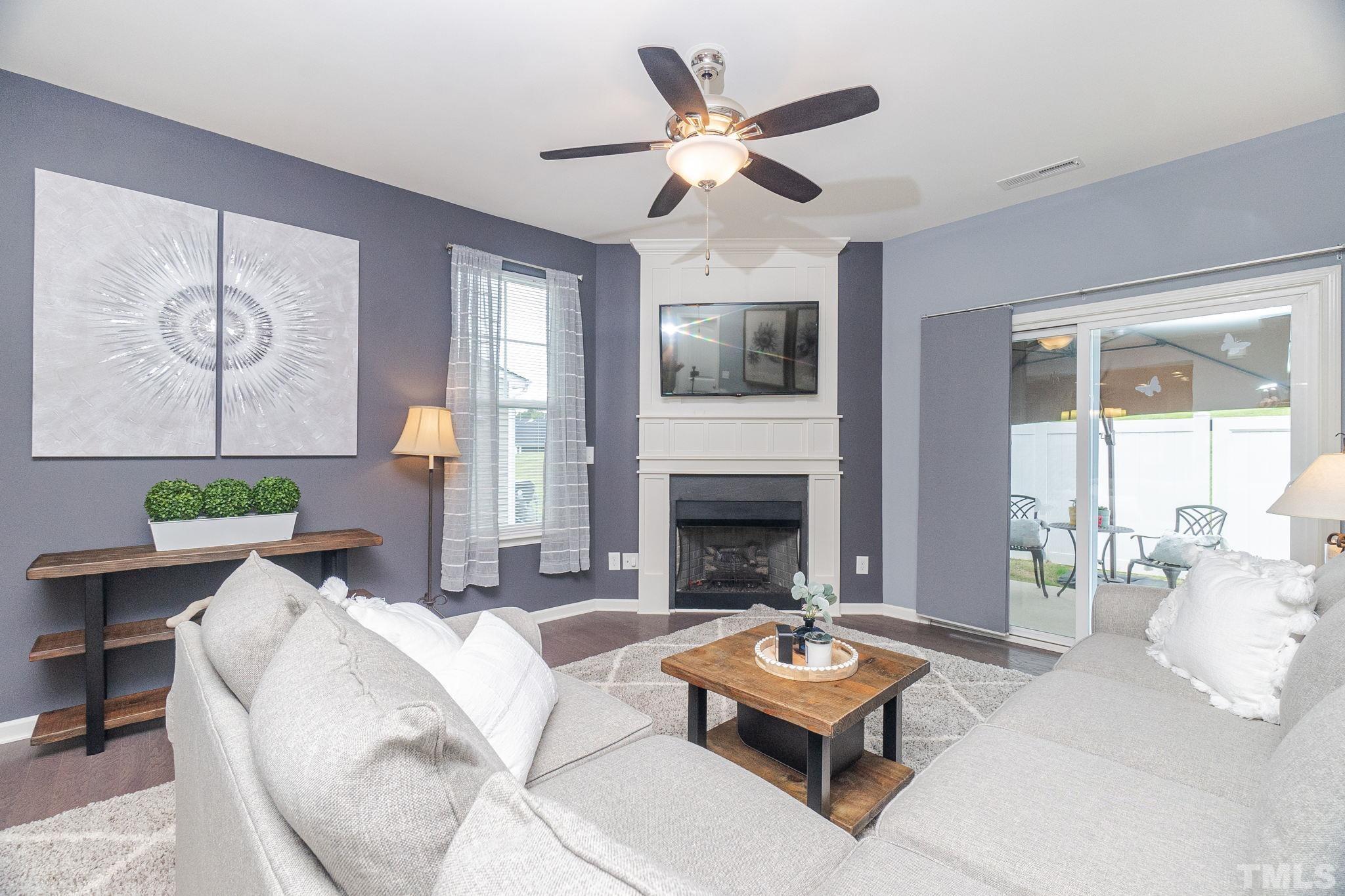 219 Torpoint Road Durham, NC 27703 - Photo 17 of 43 a living room with furniture fireplace and window