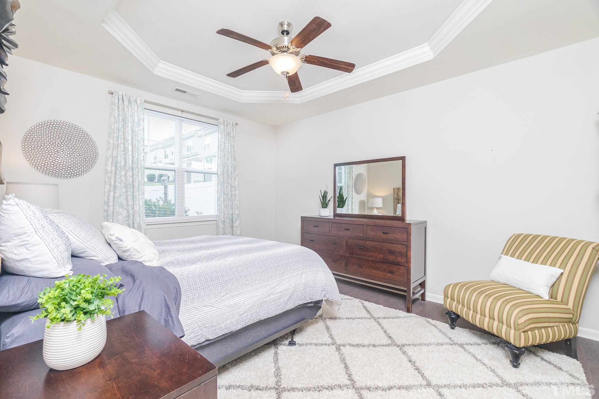 219 Torpoint Road Durham, NC 27703 - Photo 21 of 43 a bedroom with a bed mirror and window