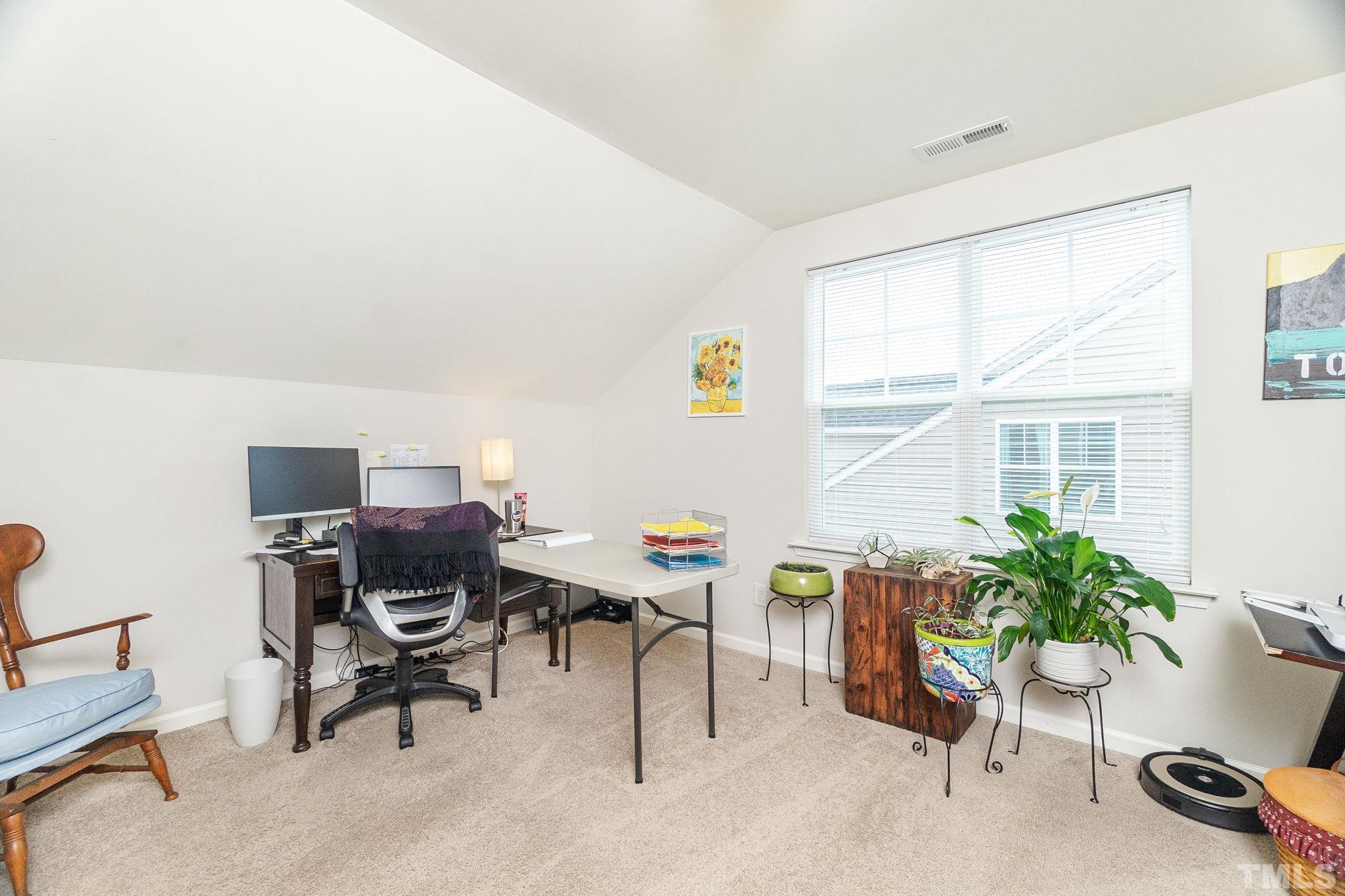 219 Torpoint Road Durham, NC 27703 - Photo 26 of 43 a workspace with furniture and a window