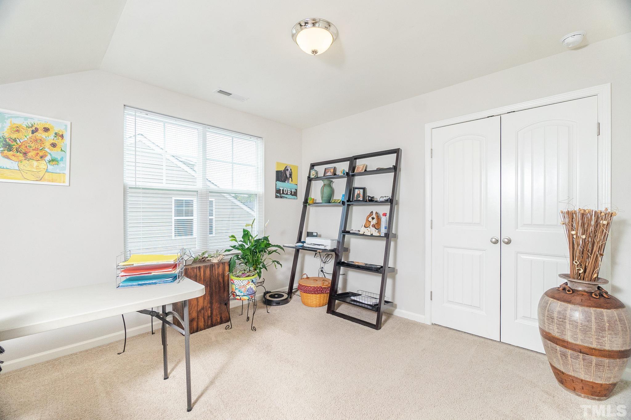 219 Torpoint Road Durham, NC 27703 - Photo 27 of 43 a living room with furniture and a window