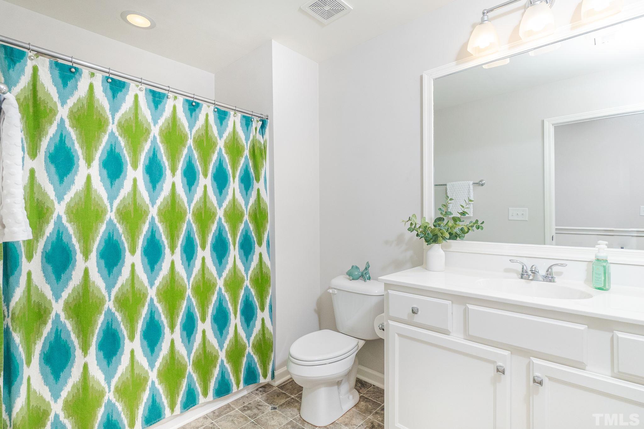 219 Torpoint Road Durham, NC 27703 - Photo 28 of 43 a bathroom with a sink and a mirror