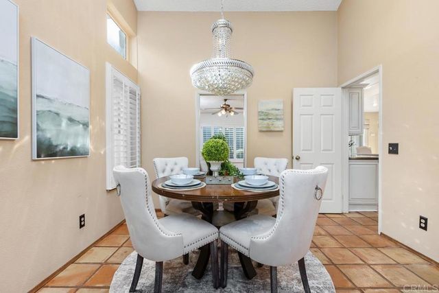 a view of a dining room with furniture and window
