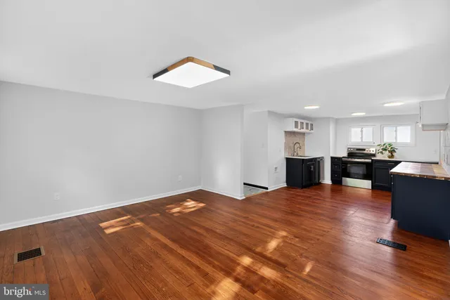a view of kitchen and dining room with wooden floor