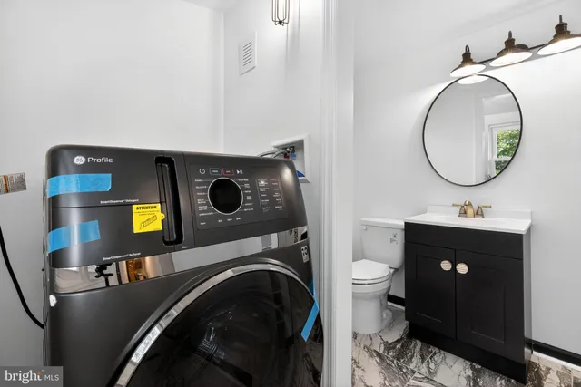 a bathroom with a toilet and a sink