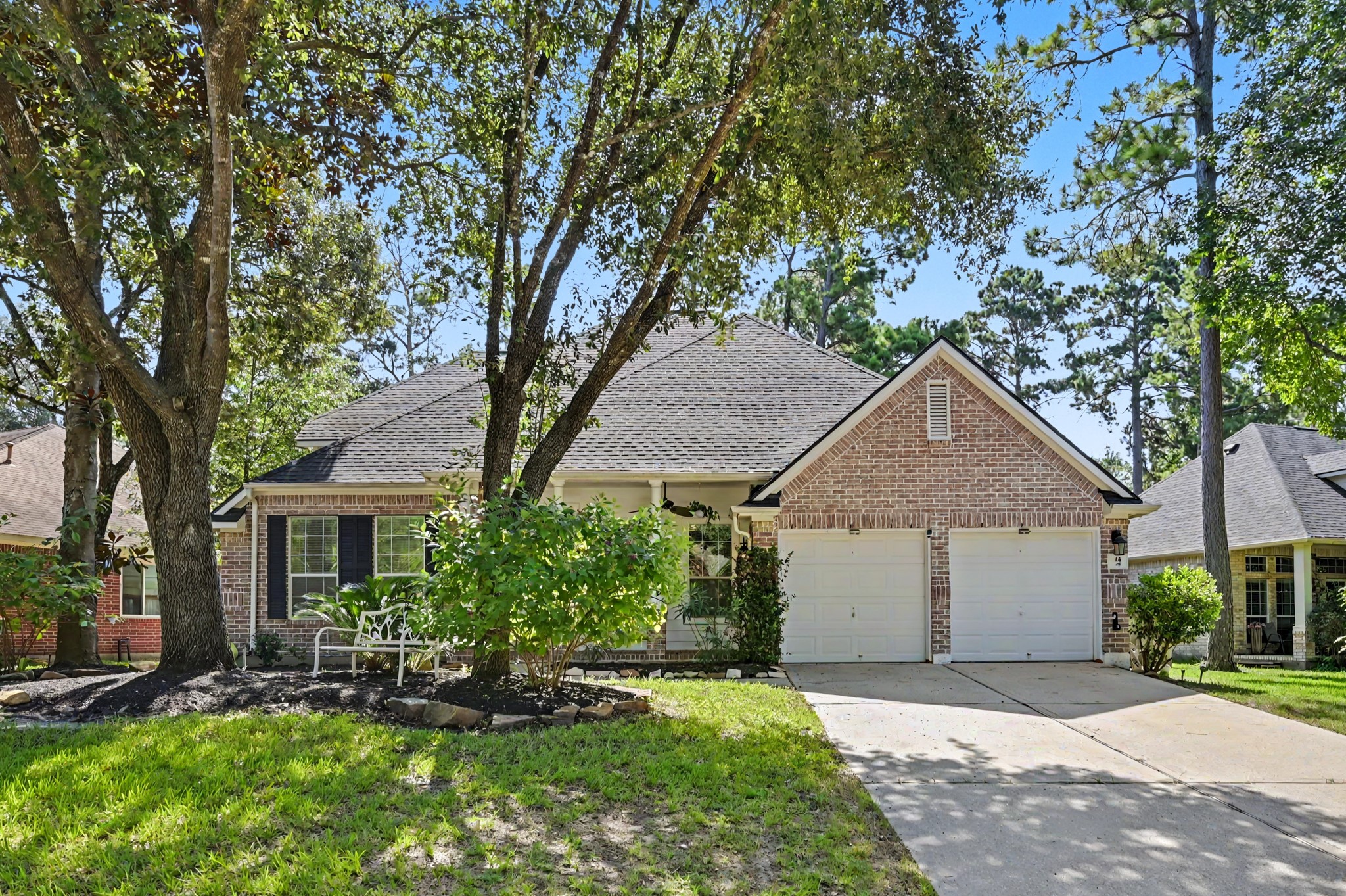 14 South Rambling Ridge Place The Woodlands, TX 77385 - Photo 2 of 42 Mature shade trees and established landscaping create exceptional curb appeal.