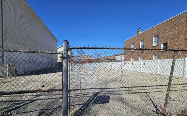 a view of a house with a wall