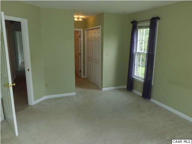 336 Minor Ridge Road Charlottesville, VA 22901 - Photo 8 of 20 an empty room with windows and closet