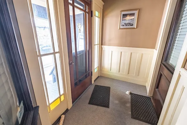a view of an entryway with a door
