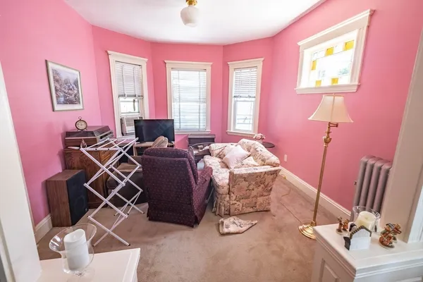 a bed room with a bed and a chair