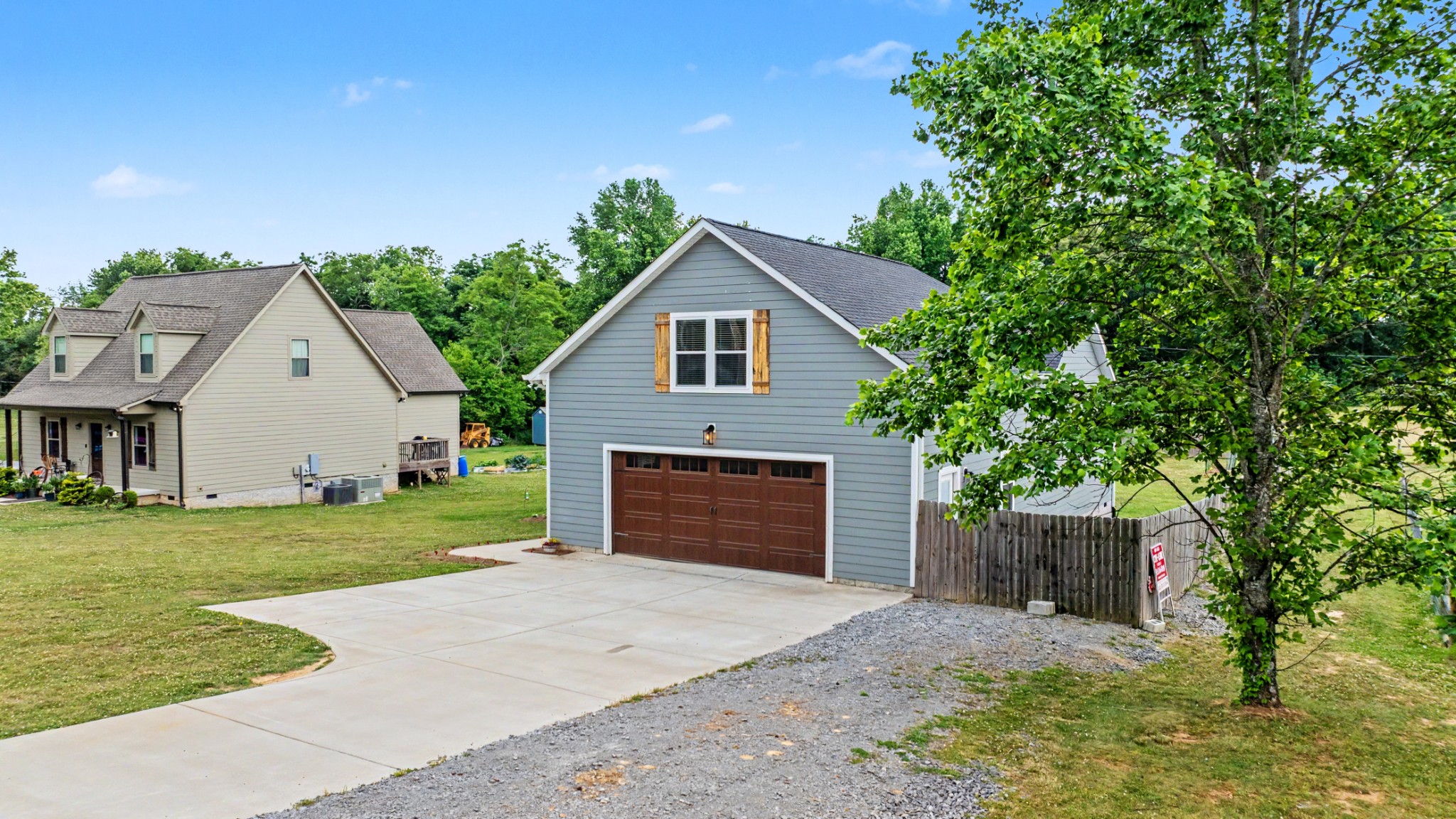 601 King Ridge Road Dowelltown, TN 37059 - Photo 5 of 49 a front view of a house with a garden and yard