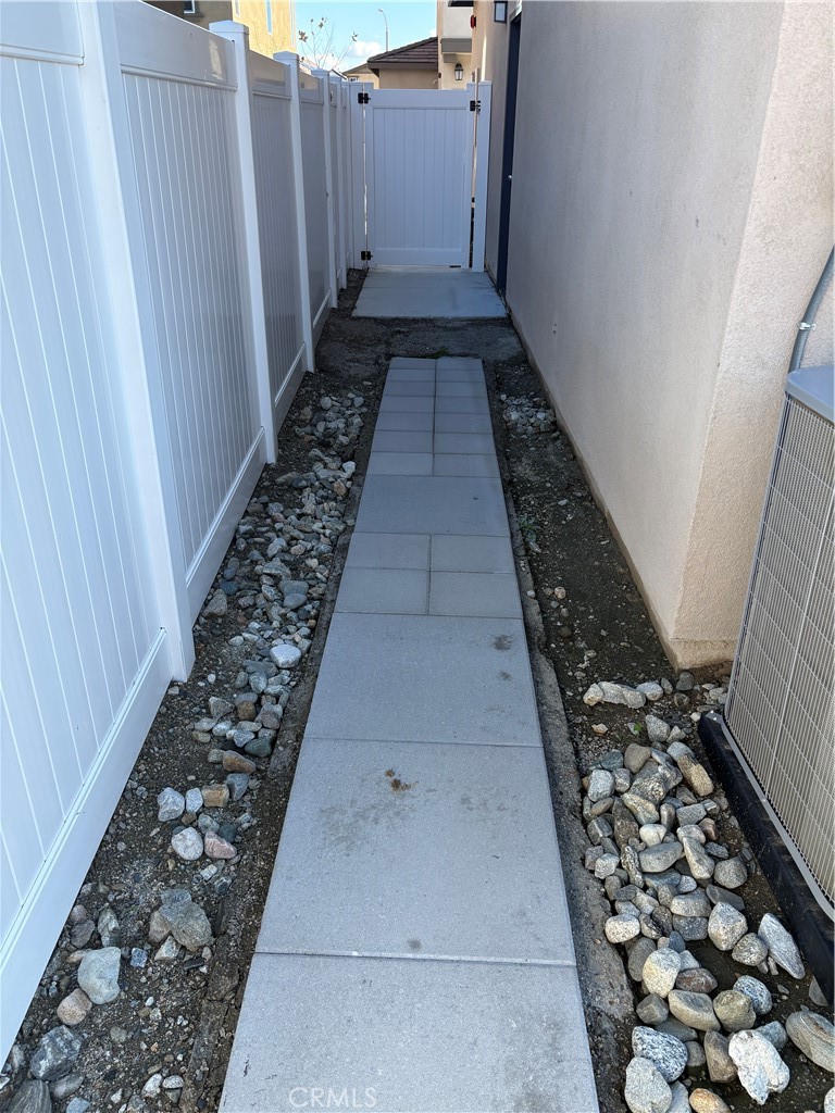 2544 Gunner Ridge Way Rialto, CA 92377 - Photo 17 of 22 a view of a pathway door with wooden floor
