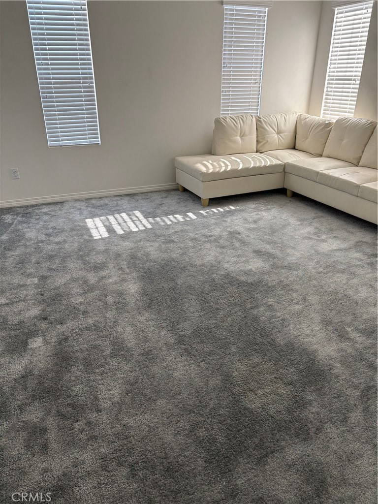 2544 Gunner Ridge Way Rialto, CA 92377 - Photo 20 of 22 a view of a room with furniture and a window