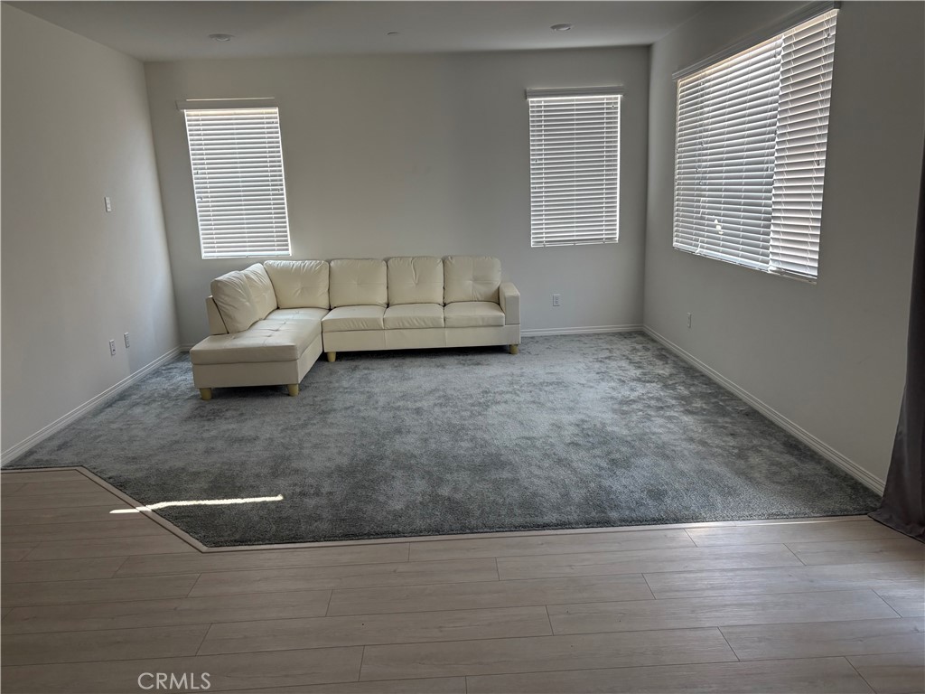 2544 Gunner Ridge Way Rialto, CA 92377 - Photo 21 of 22 a living room with furniture and a window