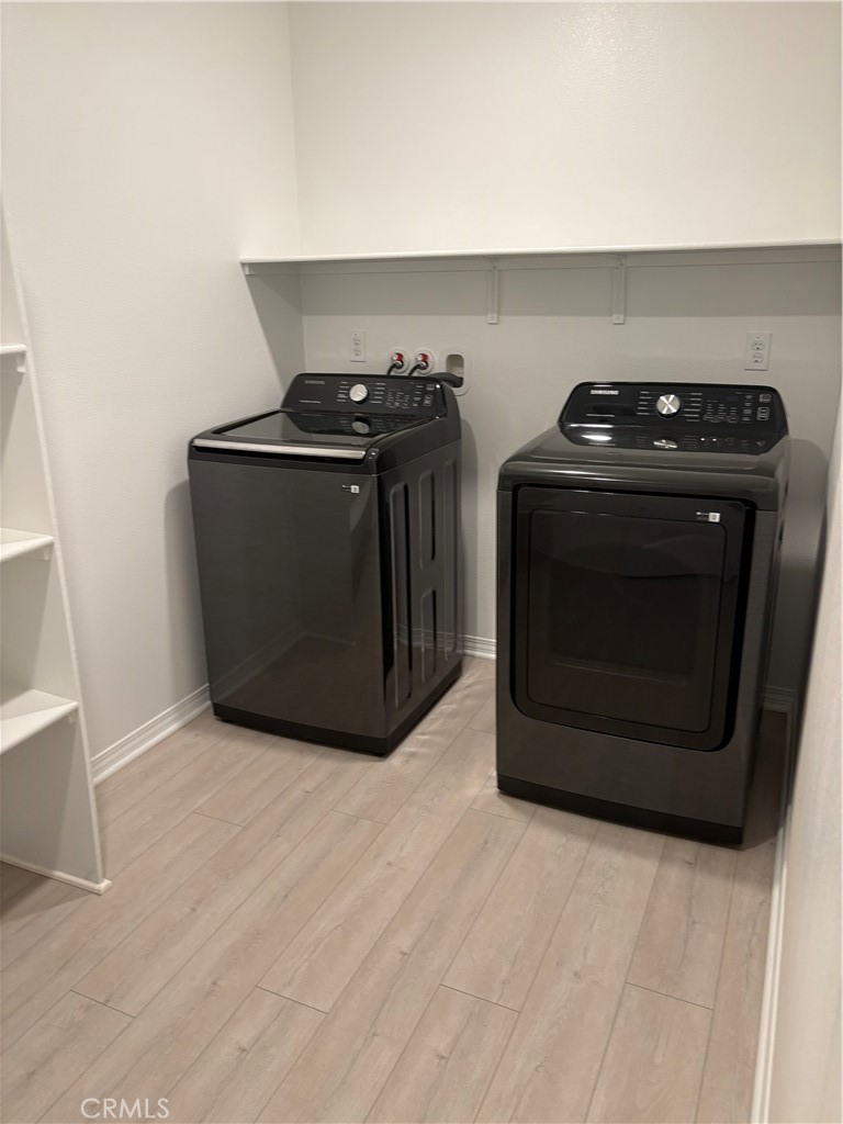 2544 Gunner Ridge Way Rialto, CA 92377 - Photo 5 of 22 a kitchen with a stove and a microwave