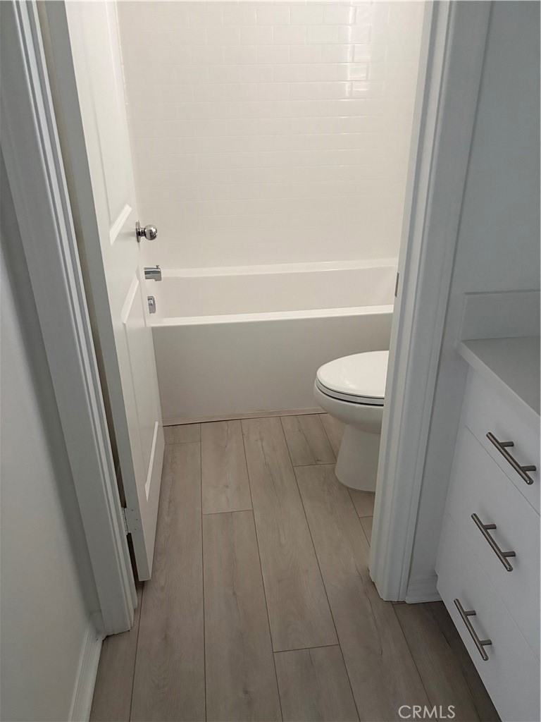 2544 Gunner Ridge Way Rialto, CA 92377 - Photo 8 of 22 a bathroom with a toilet and a shower