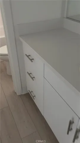 a white toilet sitting next to a white sink