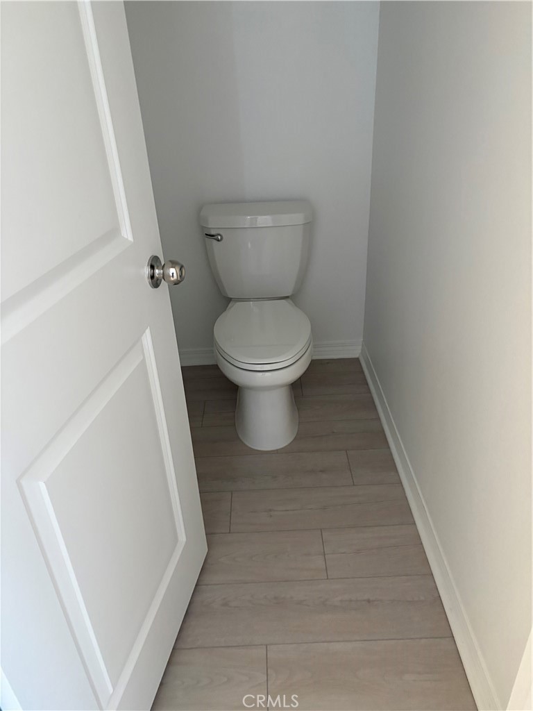 2544 Gunner Ridge Way Rialto, CA 92377 - Photo 10 of 22 a white toilet sitting next to a white sink