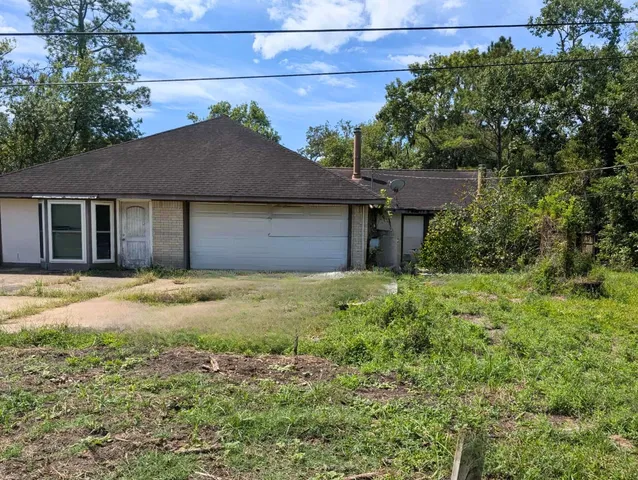 a house with a tree in front of it