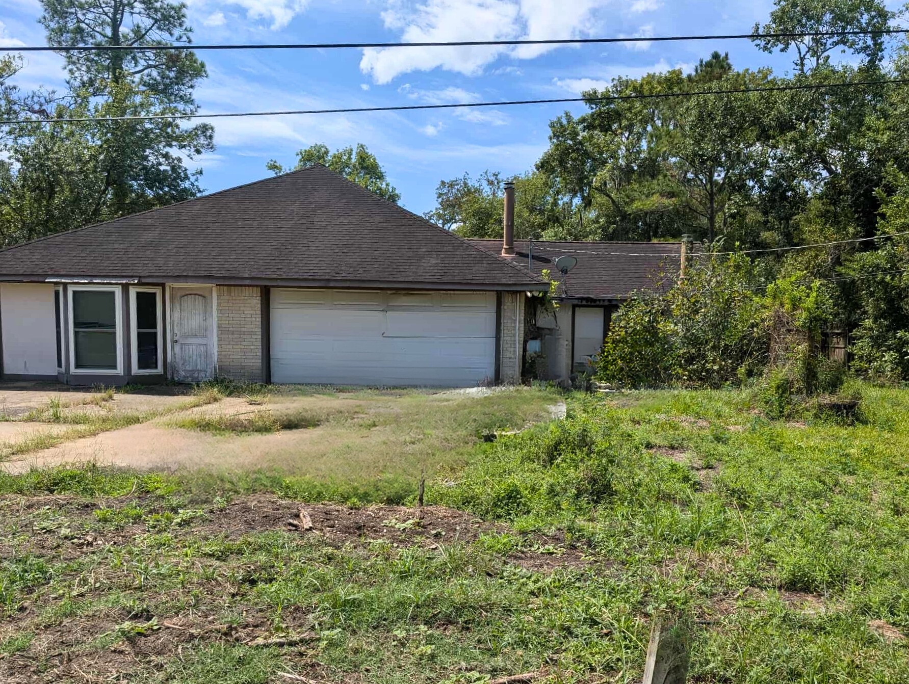 1225 County Road 878B Sweeny, TX 77480 - Photo 4 of 9 a house with a tree in front of it