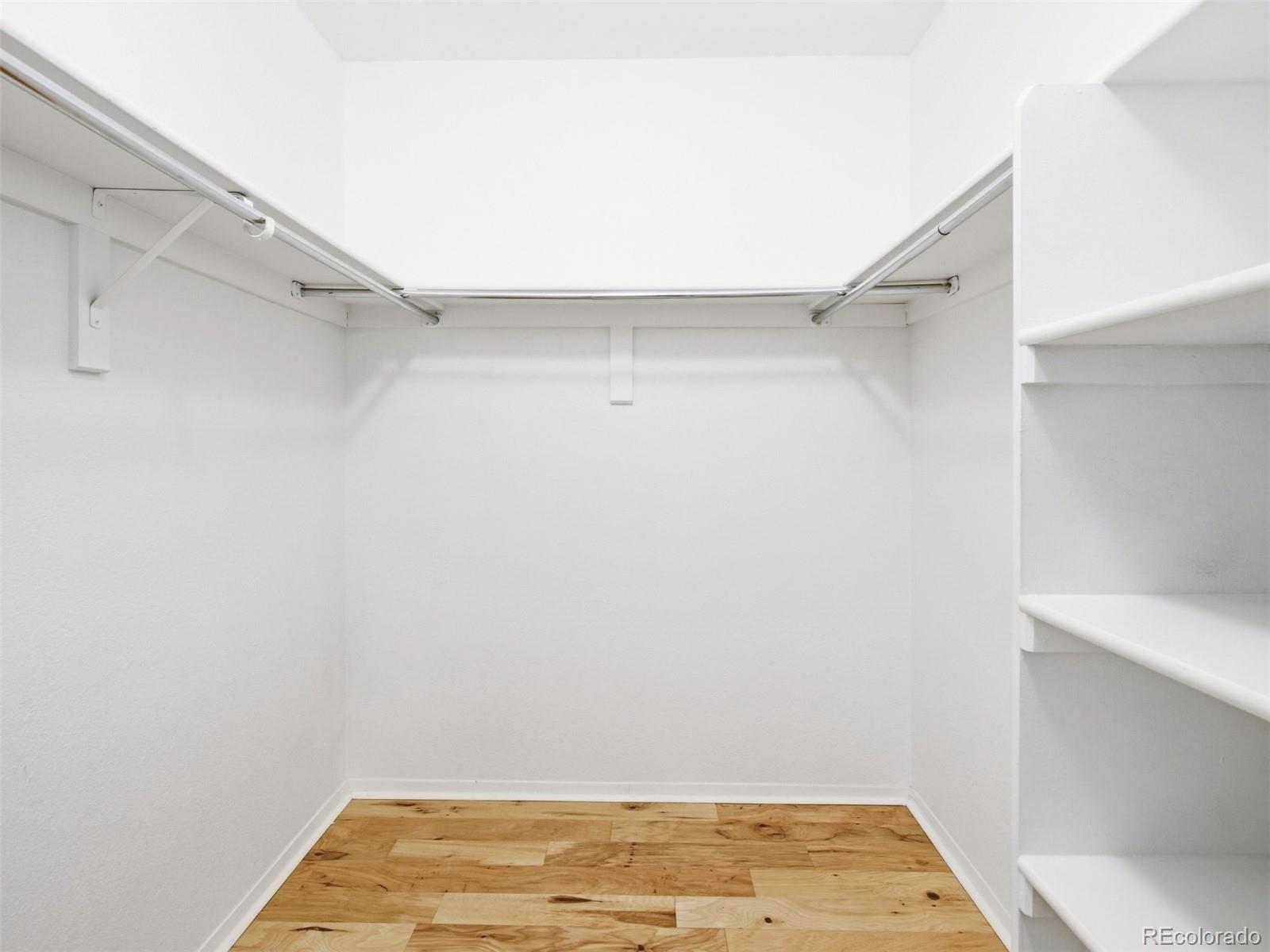 4301 South Pierce Street, Unit 2D Denver, CO 80123 - Photo 22 of 39 a view of a room with wooden floor