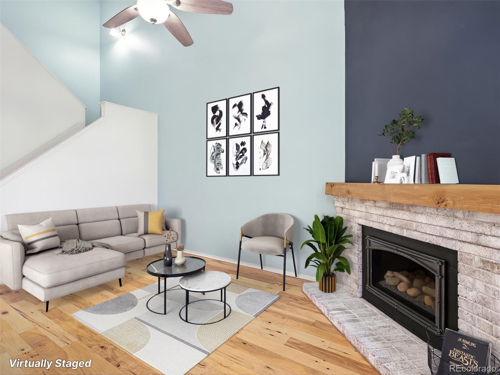 4301 South Pierce Street, Unit 2D Denver, CO 80123 - Photo 3 of 39 a living room with furniture and a fireplace